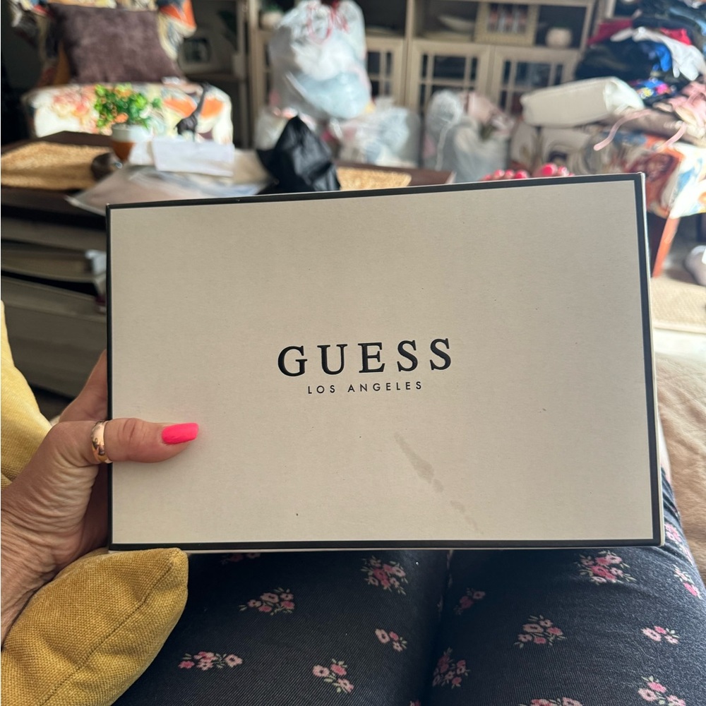 Brand new!! Never used!! Absolutely beautiful white with gold guess sneakers.